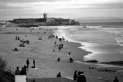 High angle view of people enjoying at beach