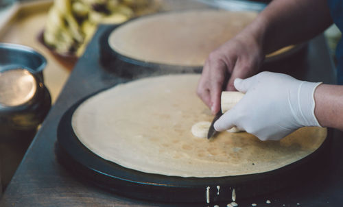 Close-up of person preparing food