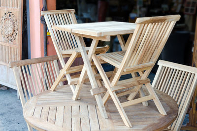 Close-up of empty chairs and table in cafe