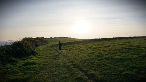 Man on field against sky