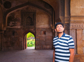 Full length of man standing at historical building