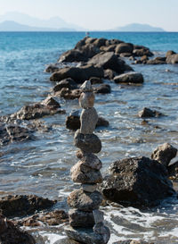 Stacked stones to the tower built on the beach of kos greece