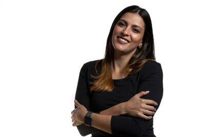 Portrait of a smiling young woman over white background