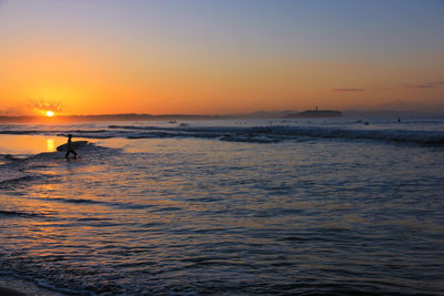 Scenic view of sea against sky during sunset