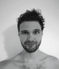 Portrait of young man against white background