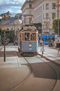 Cable car on road in city