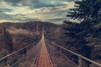 View of footbridge against sky