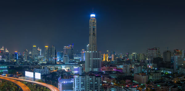 Illuminated buildings in city at night