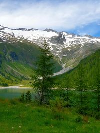 Scenic view of snowcapped mountains against sky