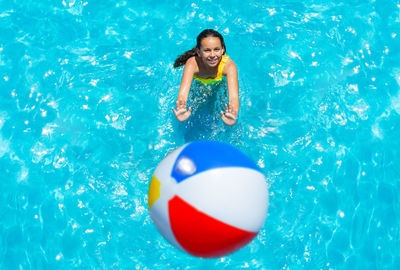 Midsection of woman with balloons