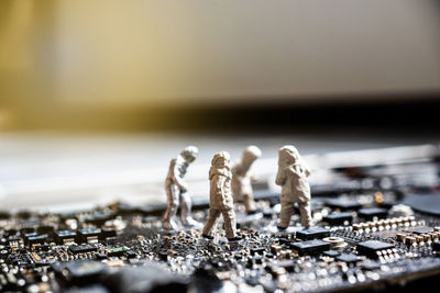 Close-up of figurines on computer chip