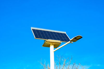 Low angle view of basketball hoop against blue sky