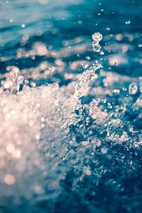 Close-up of water splashing in sea