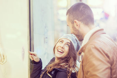 Happy couple in city during winter