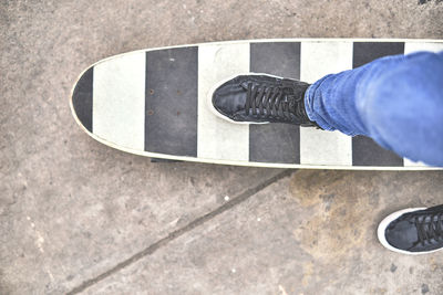 Young skateboarding on the streets, close up on shoes, transportation in the new normal