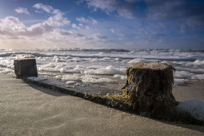 Scenic view of beach against sky