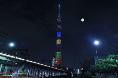 Low angle view of illuminated buildings at night