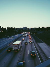 High angle view of vehicles on road against sky