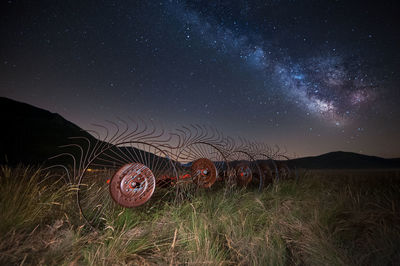 Scenic view of field against sky at night