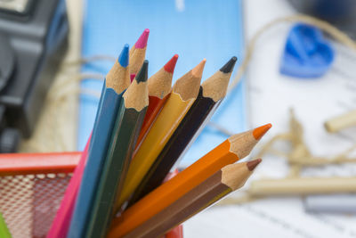 Close-up of colored pencils in container