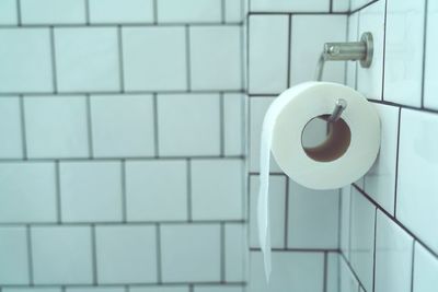 Close-up of toilet paper in restroom