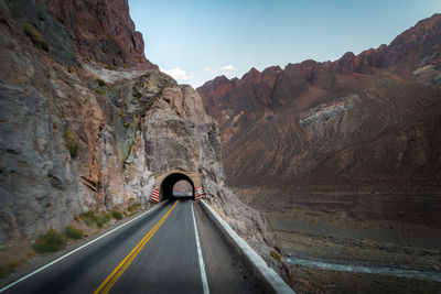 Empty road against mountain