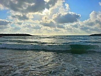 Scenic view of sea against cloudy sky