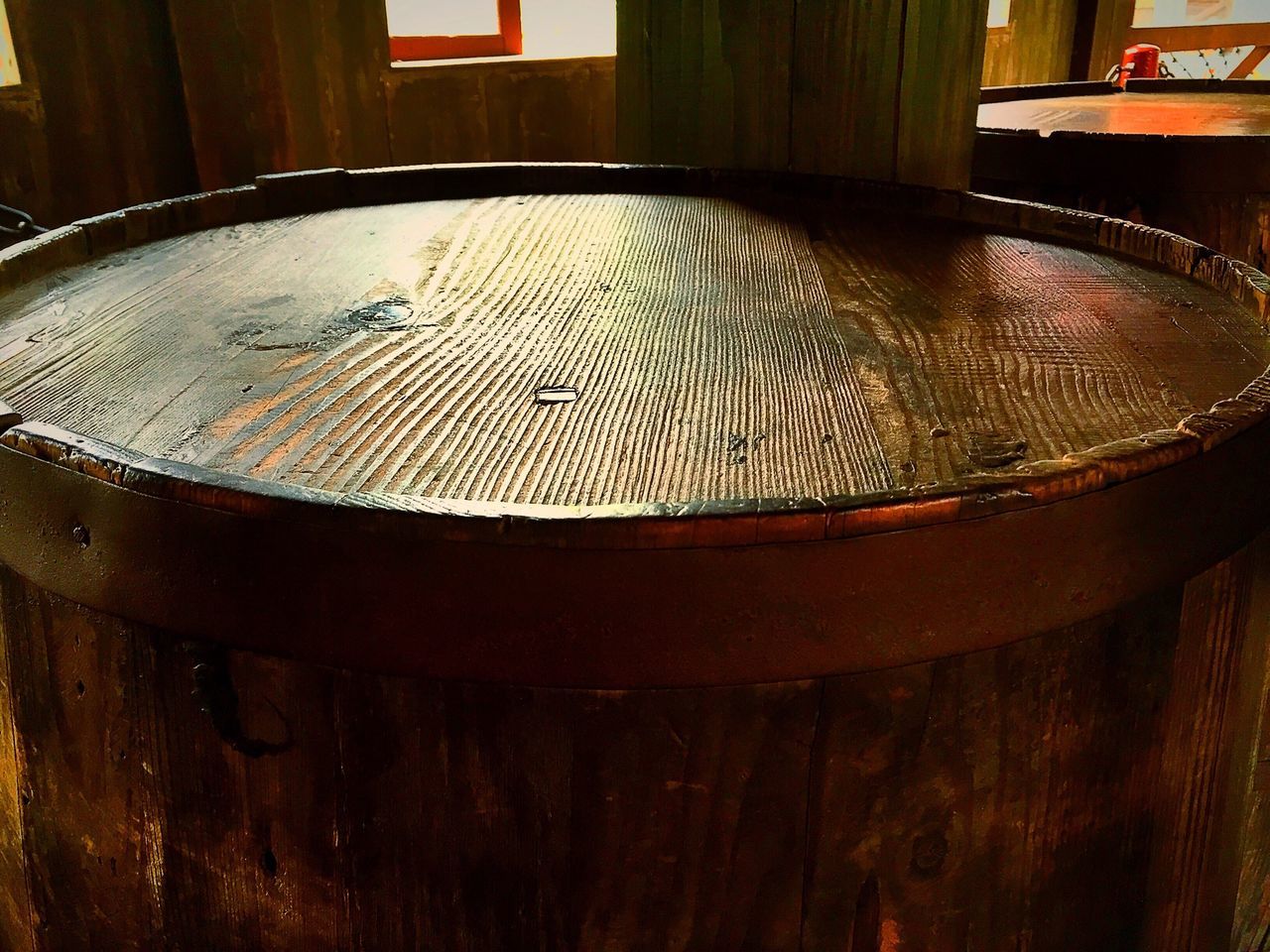 wood - material, close-up, indoors, table, wooden, metal, no people, focus on foreground, built structure, pattern, rusty, still life, day, architecture, design, old, chair, circle, metallic