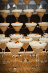 Close-up of dessert in martini glasses arranged on table