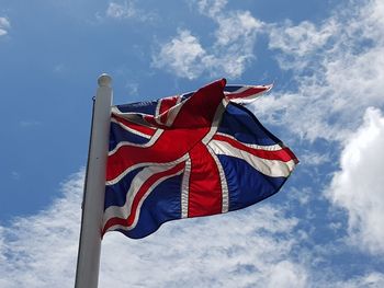 Low angle view of flag against sky