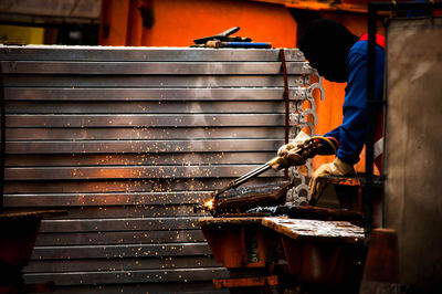 Man working on metal structure