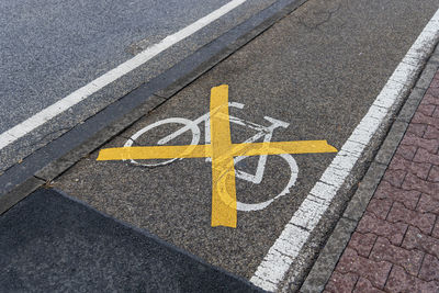 High angle view of road sign on street