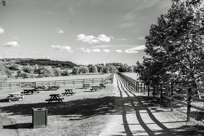 High angle view of footpath by trees against sky