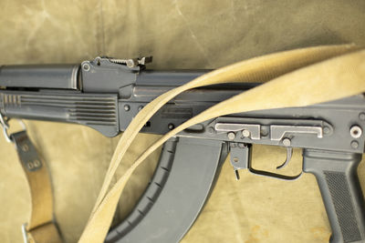 Automatic weapon parts. barrel of machine gun. training weapon is on table.