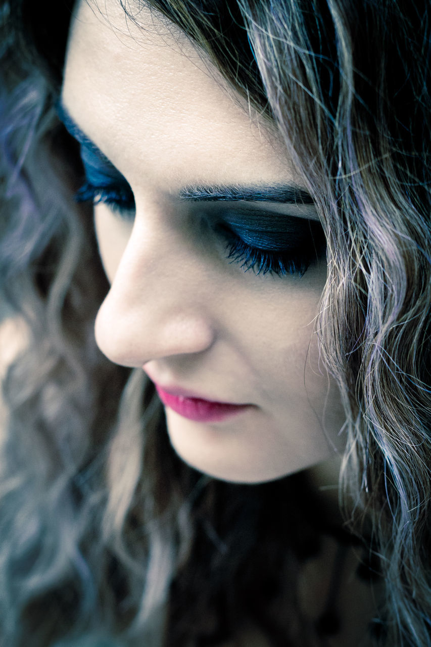 CLOSE-UP PORTRAIT OF WOMAN WITH HAIR