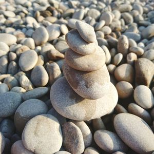 Close-up of stacked stones at beach
