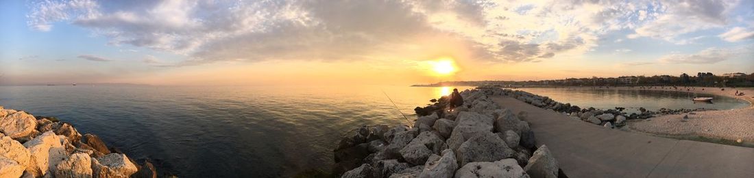 Panoramic view of sea against sky during sunset