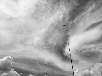 Low angle view of airplane flying in sky