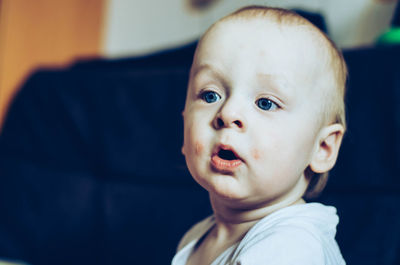 Close-up of cute baby at home