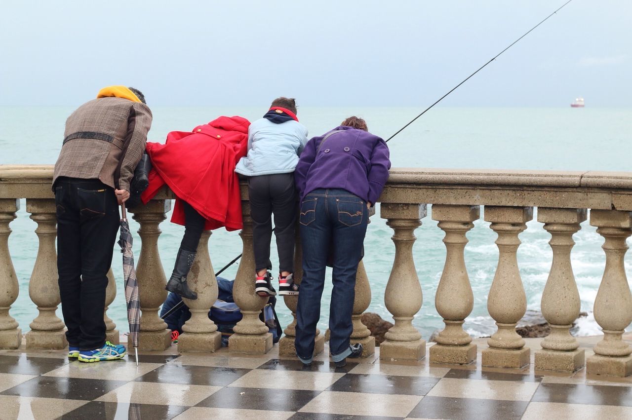 men, rear view, lifestyles, full length, standing, leisure activity, casual clothing, walking, water, sky, person, blue, clear sky, boys, day, sea