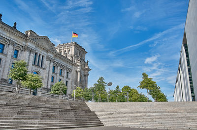 Low angle view of building against clear blue sky