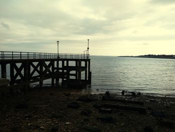 Pier on sea against sky