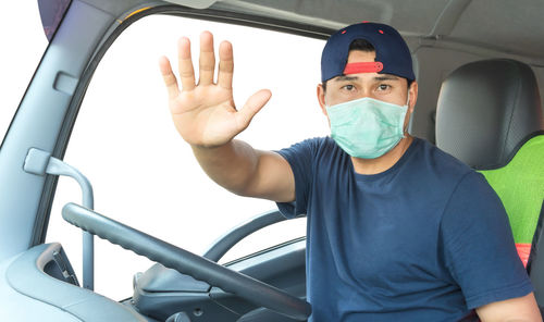 Portrait of man sitting in car