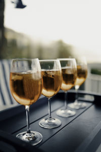 Close-up of wine glasses on table