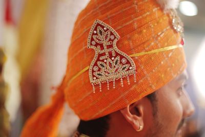 Close-up of young man wearing turban during wedding ceremony