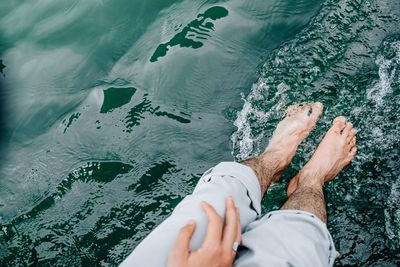 Low section of person in swimming pool