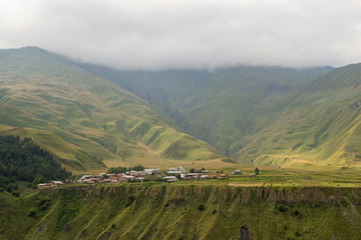 Mountainous terrain on the georgian military road. clouds over the mountains