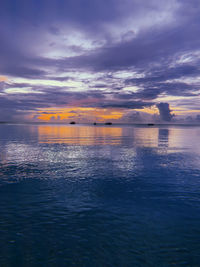 Scenic view of sea against sky at sunset