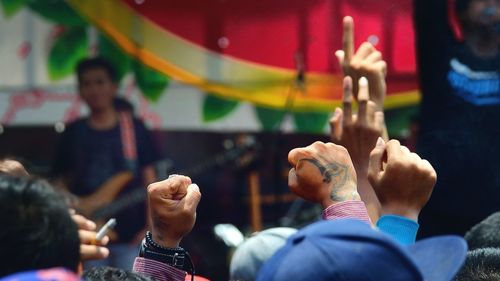 Arms raised at music concert