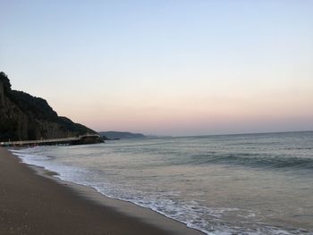 Scenic view of sea against clear sky during sunset